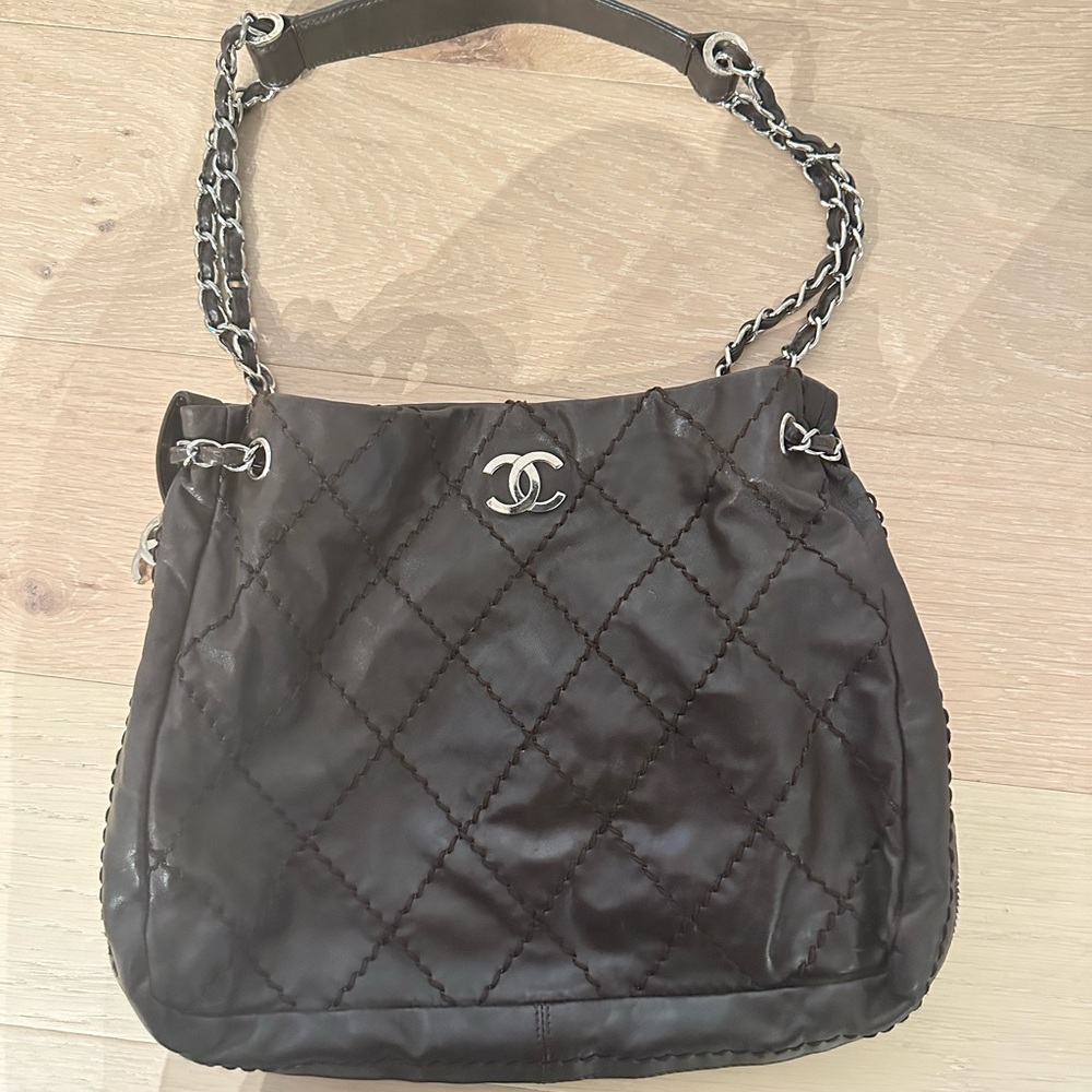 CHANEL Ultimate Stitch Expandable Hobo leather bag in dark brown.
